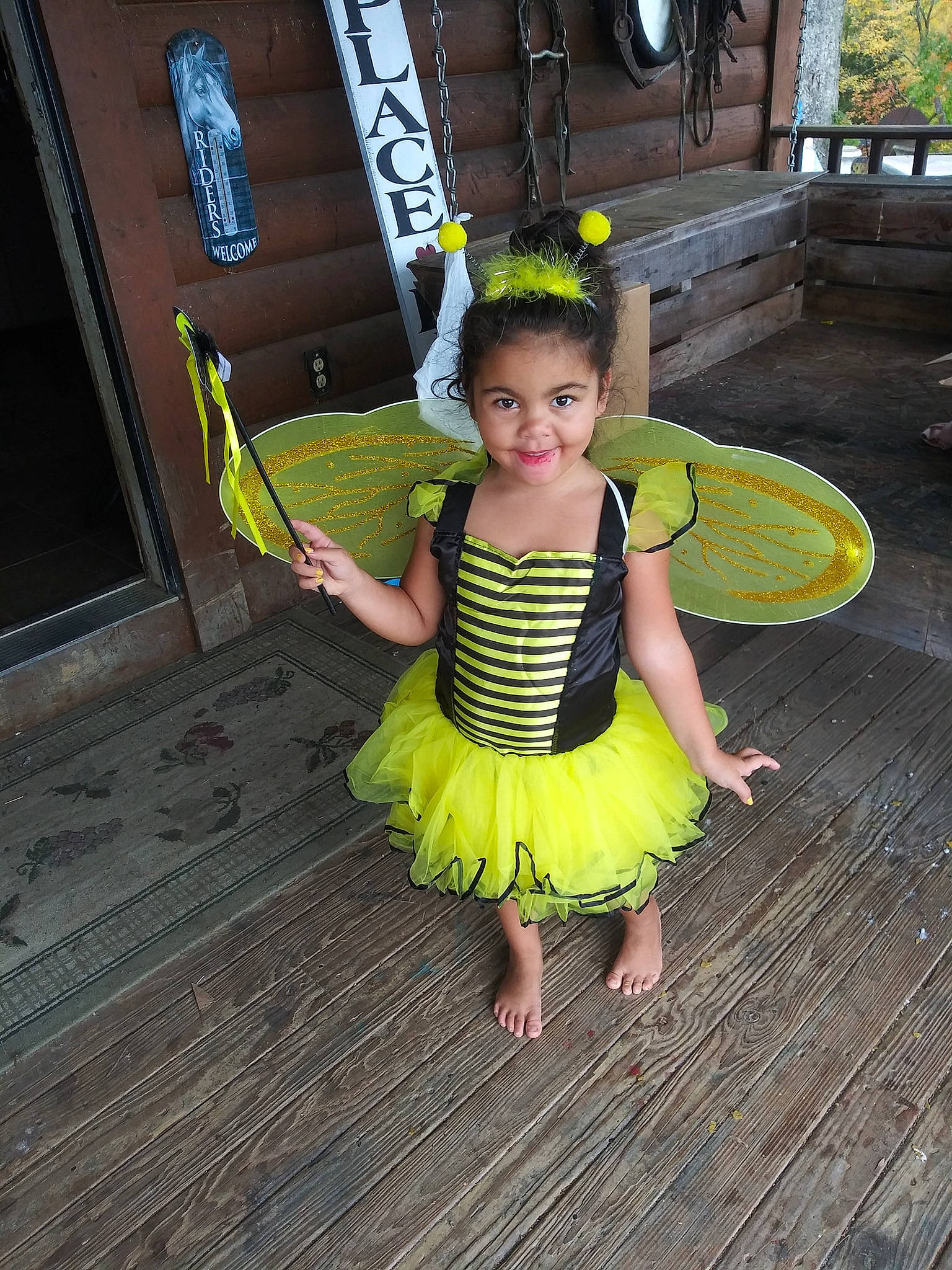Harleigh joined the competition — help win amazing prizes! baby_toddler_clothing, bench, child, child_model, costume, costume_accessory, day_dress, dress, green, hair_accessory, joy, one_piece_garment, pattern, person, ruffle, toddler, yellow