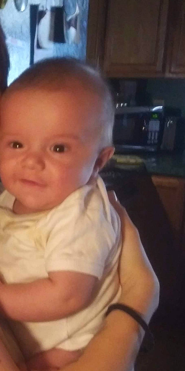 Kayden is registered to the contest to win money with this photo: baby, baby_products, baby_toddler_clothing, cheek, child, chin, comfort, countertop, ear, eyebrow, home_appliance, iris, kitchen, kitchen_appliance, lip, major_appliance, microwave_oven, person, skin, small_appliance