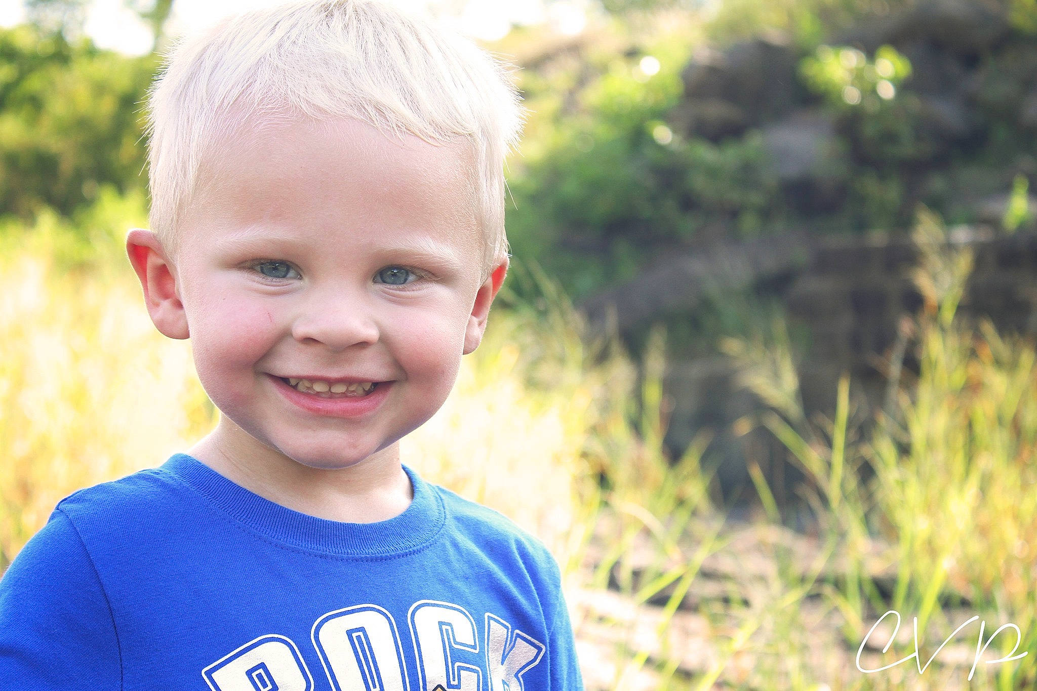 Berkley is registered to the contest to win money with this photo: blond, cheek, child, chin, eye, face, facial_expression, fun, grass, hair, happy, head, joy, male, people, person, photograph, portrait, skin, smile
