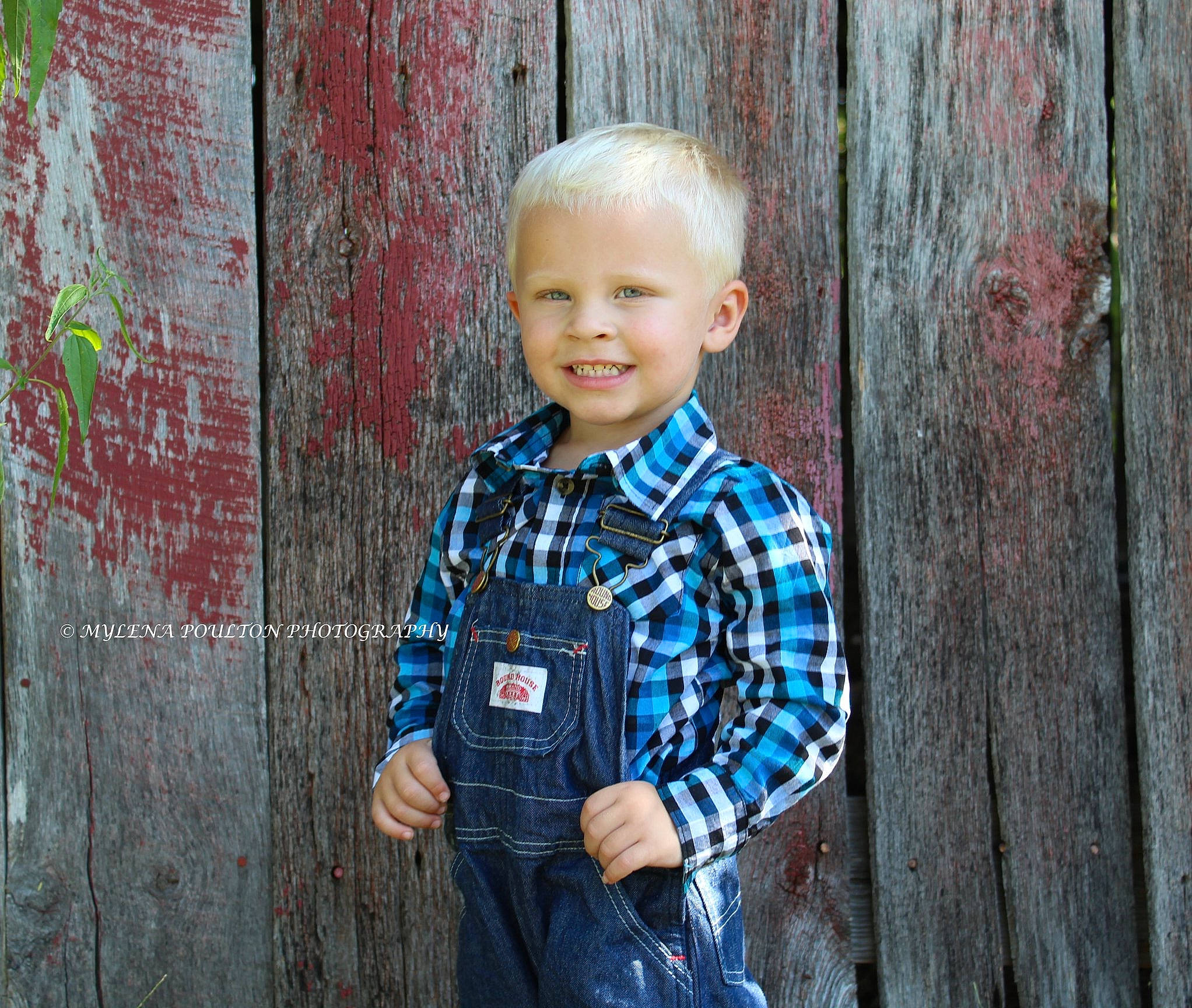 Berkley is registered to the contest to win money with this photo: child, child_model, denim, design, joy, male, pattern, person, photograph, photography, plaid, portrait_photography, smile, standing, textile, toddler, wood