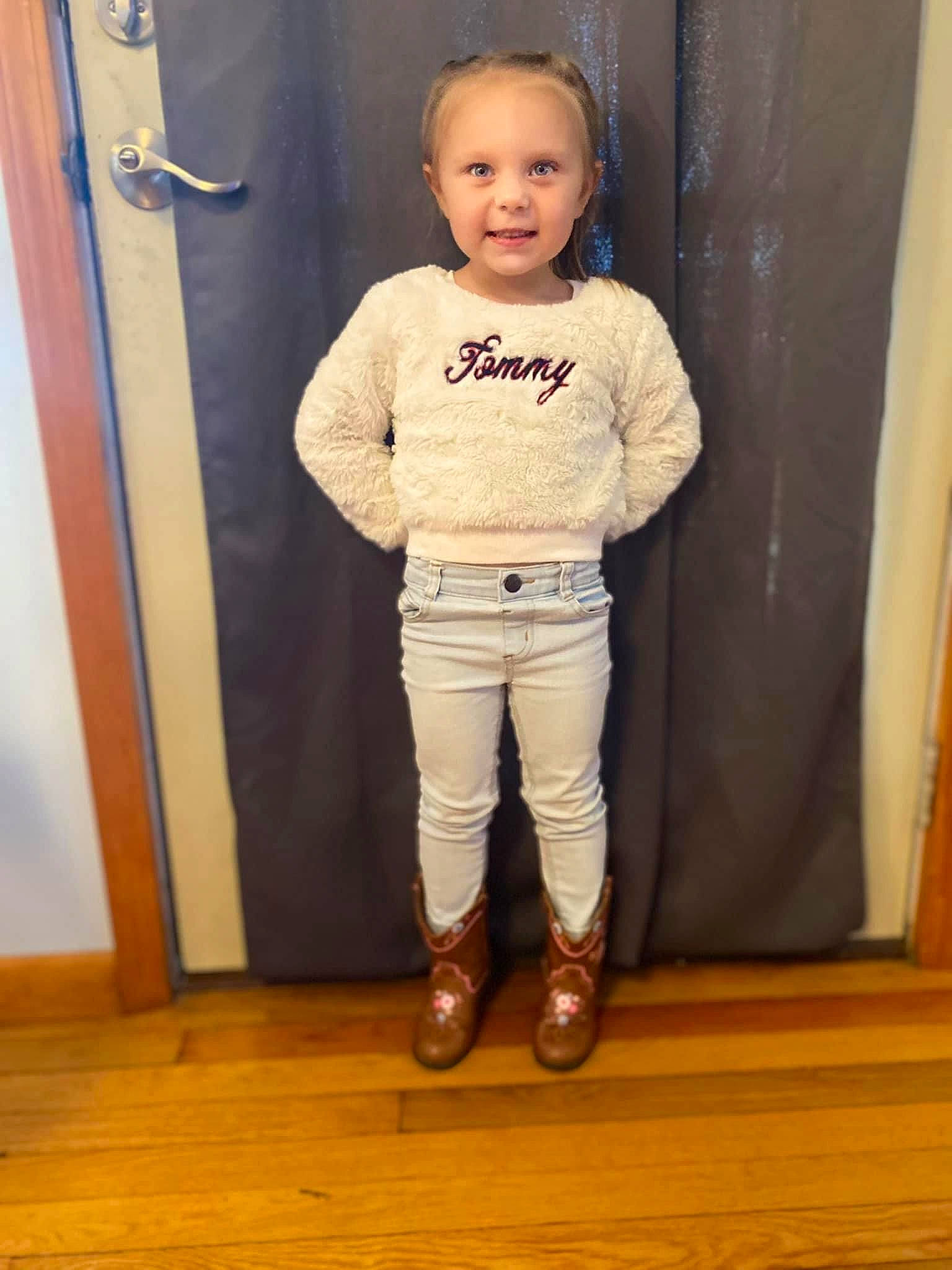 Layla joined the competition — help win amazing prizes! baby_toddler_clothing, child, door, fashion_design, flooring, gesture, hardwood, human_leg, joy, knee, laminate_flooring, person, sleeve, smile, sportswear, thigh, toddler, varnish, waist, wood