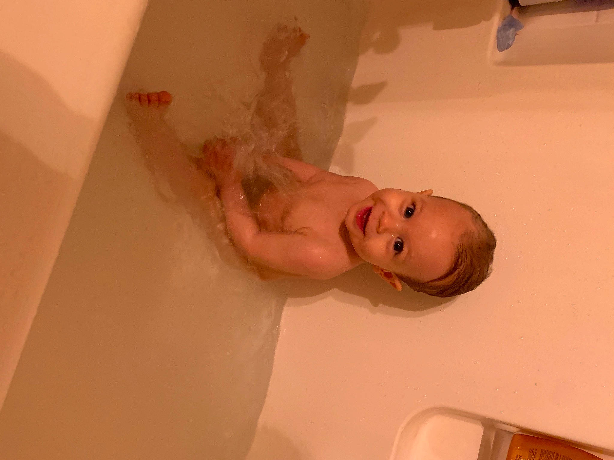 Nyla May is registered to the contest to win money with this photo: abdomen, arm, baby, bathing, bathroom, ceiling, chest, child, elbow, eyelash, flooring, happy, human_leg, jaw, joy, person, plaster, plumbing, plumbing_fixture, room