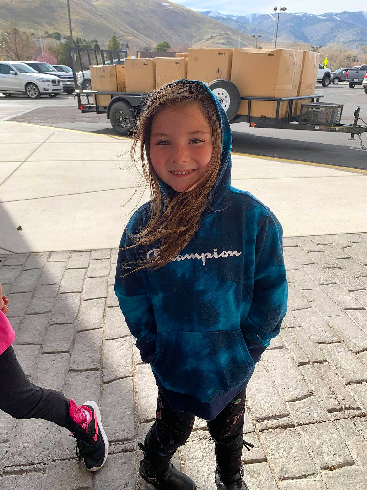 Shannah is registered to the contest to win money with this photo: asphalt, car, cool, electric_blue, fun, happy, human_leg, joy, leggings, leisure, mountain, person, personal_protective_equipment, public_space, recreation, sleeve, street_fashion, thigh, tire, travel