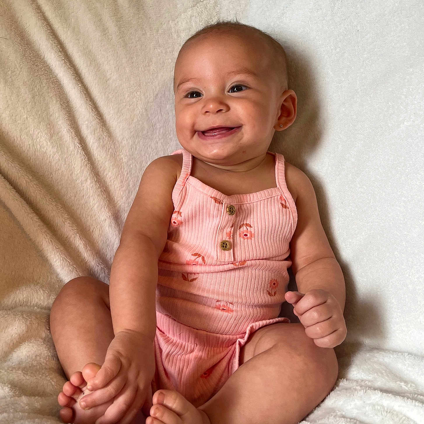 Dea joined the competition — help win amazing prizes! baby, smiling, infant, child, pink_clothing, romper, barefoot, sitting, soft_blanket, happy, cute, portrait, skin, face, head, toe, hand, indoors, light, cozy