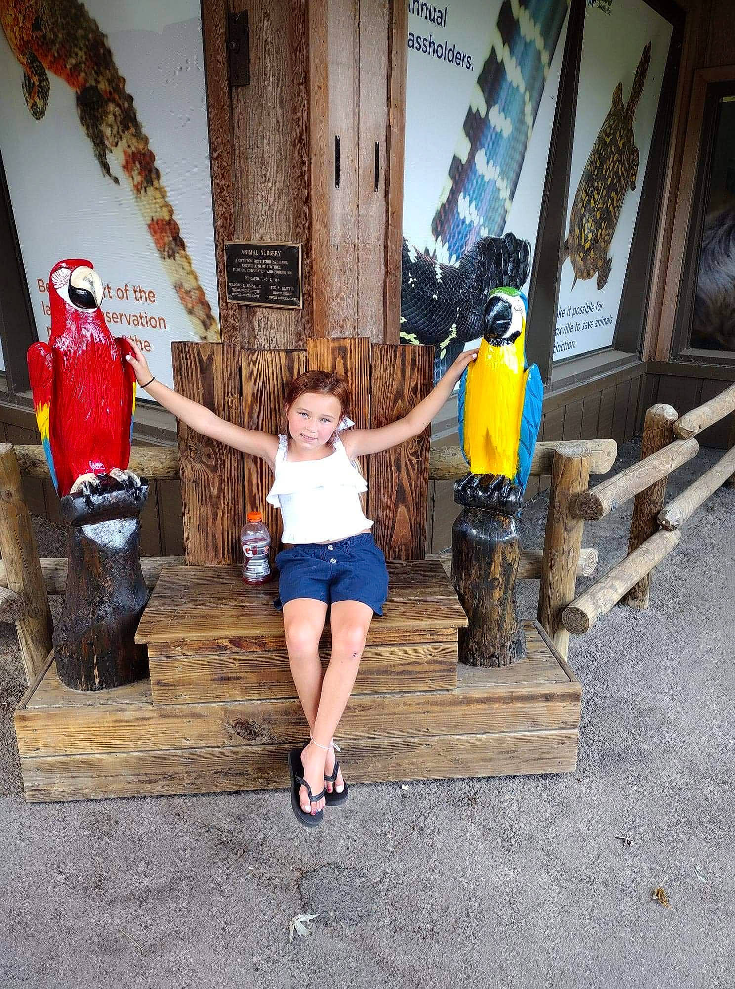 Chloe is registered to the contest to win money with this photo: boot, flash_photography, flooring, fun, human_leg, joy, leisure, person, room, sandal, shorts, sitting, standing, t_shirt, temple, thigh, tourism, travel, vacation, visual_arts