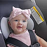 Aurelia joined the competition — help win amazing prizes! baby, infant, child, car_seat, seatbelt, harness, pink_bow, pink_clothing, portrait, smiling, face, eyes, indoor, vehicle, car, safety_warning, seated, closeup, adorable, passenger