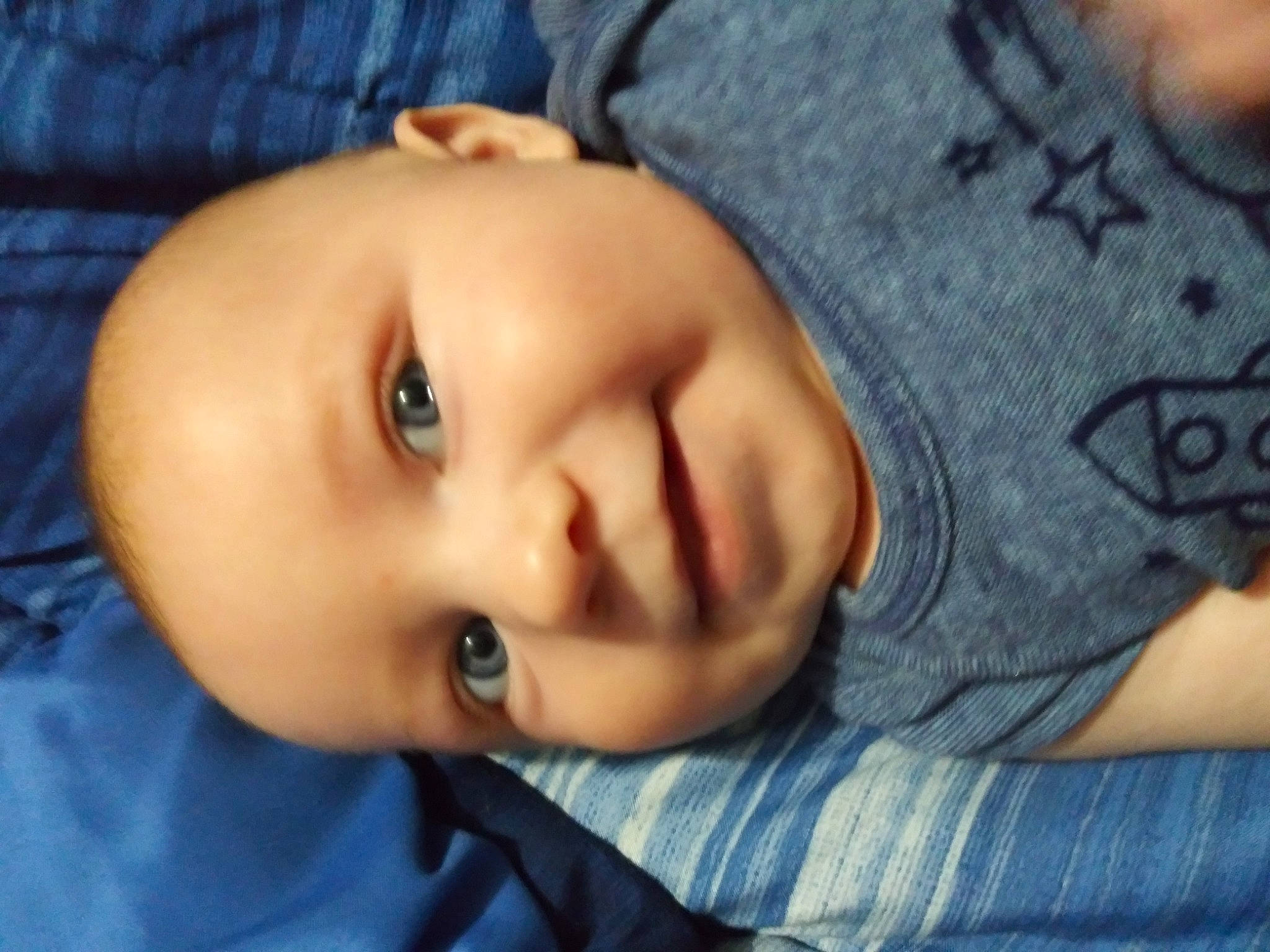 Asher is registered to the contest to win money with this photo: baby, baby_toddler_clothing, blue, cheek, comfort, cool, electric_blue, eye, eyebrow, eyelash, forehead, iris, joy, lip, mouth, neck, nose, person, skin, sleeve
