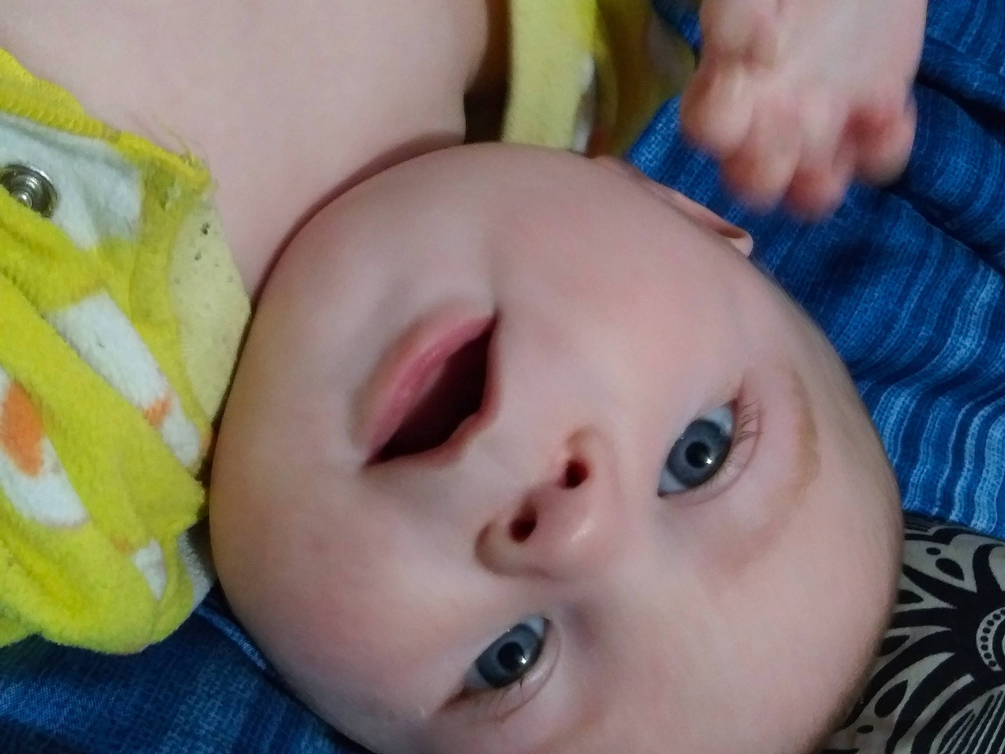 Asher is registered to the contest to win money with this photo: baby, cheek, chin, clothing, eye, eyebrow, eyelash, face, facial_expression, finger, head, headwear, iris, lip, mouth, nose, organ, person, product, skin