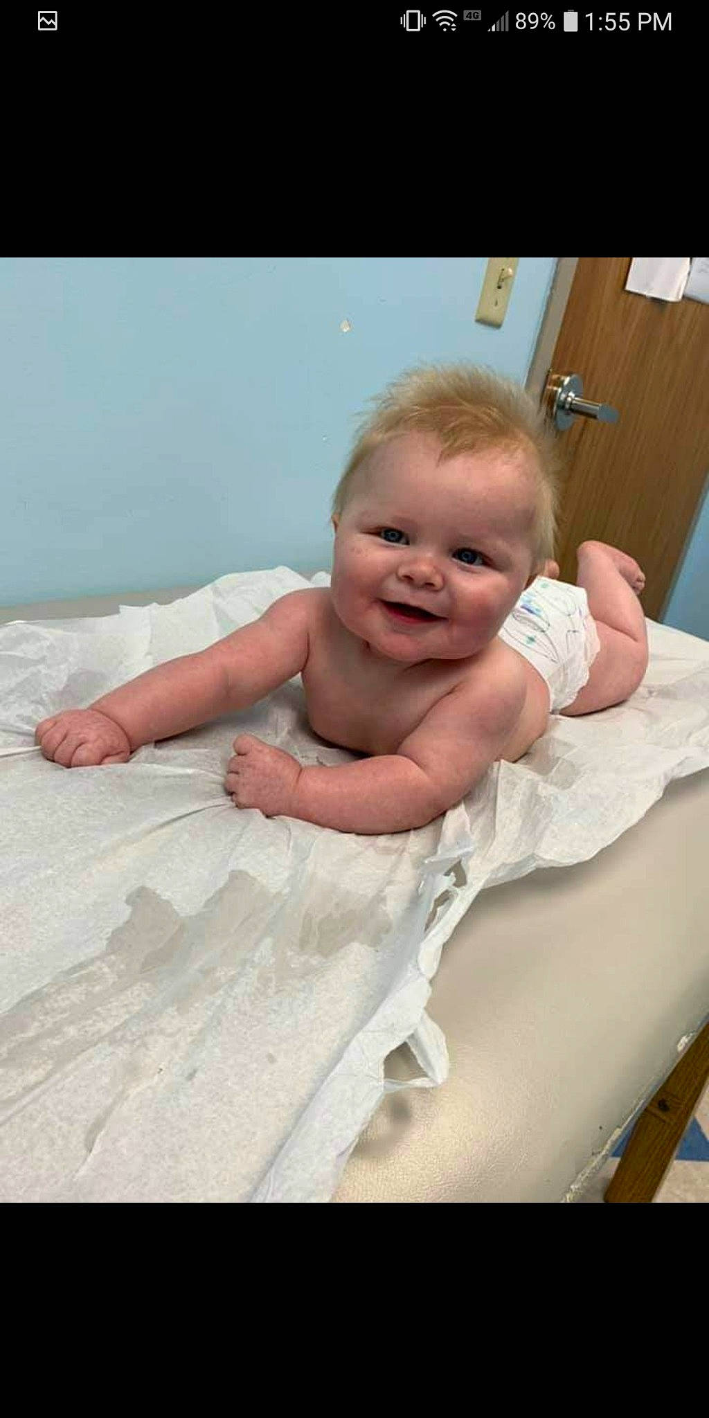 Dax is registered to the contest to win money with this photo: baby, baby_safety, baby_toddler_clothing, cheek, child, comfort, event, finger, foot, fun, gesture, happy, human_body, joy, linens, person, sitting, skin, sleeve, smile