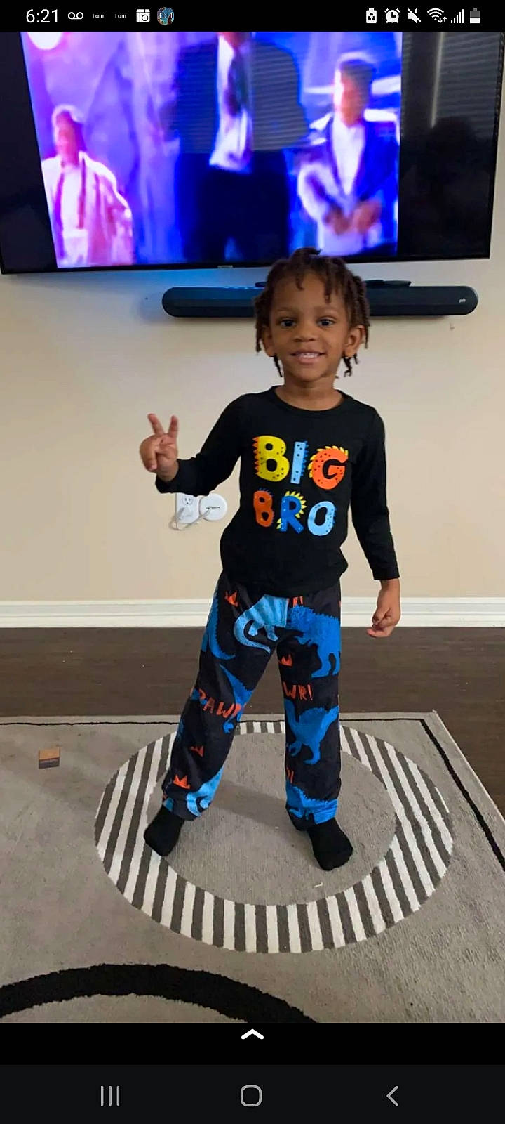 Devodric Ty'Shun is registered to the contest to win money with this photo: baby_toddler_clothing, blue, blurred, child, cool, electric_blue, fashion, floor, flooring, fun, joint, joy, leg, person, sleeve, smile, standing, sweatpant, t_shirt, television