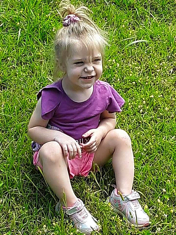 Zoey is registered to the contest to win money with this photo: baby_toddler_clothing, foot, fun, garden, grass, grassland, green, groundcover, happy, lawn, leaf, magenta, meadow, people_in_nature, person, plant, smile, spring, terrestrial_plant, toddler