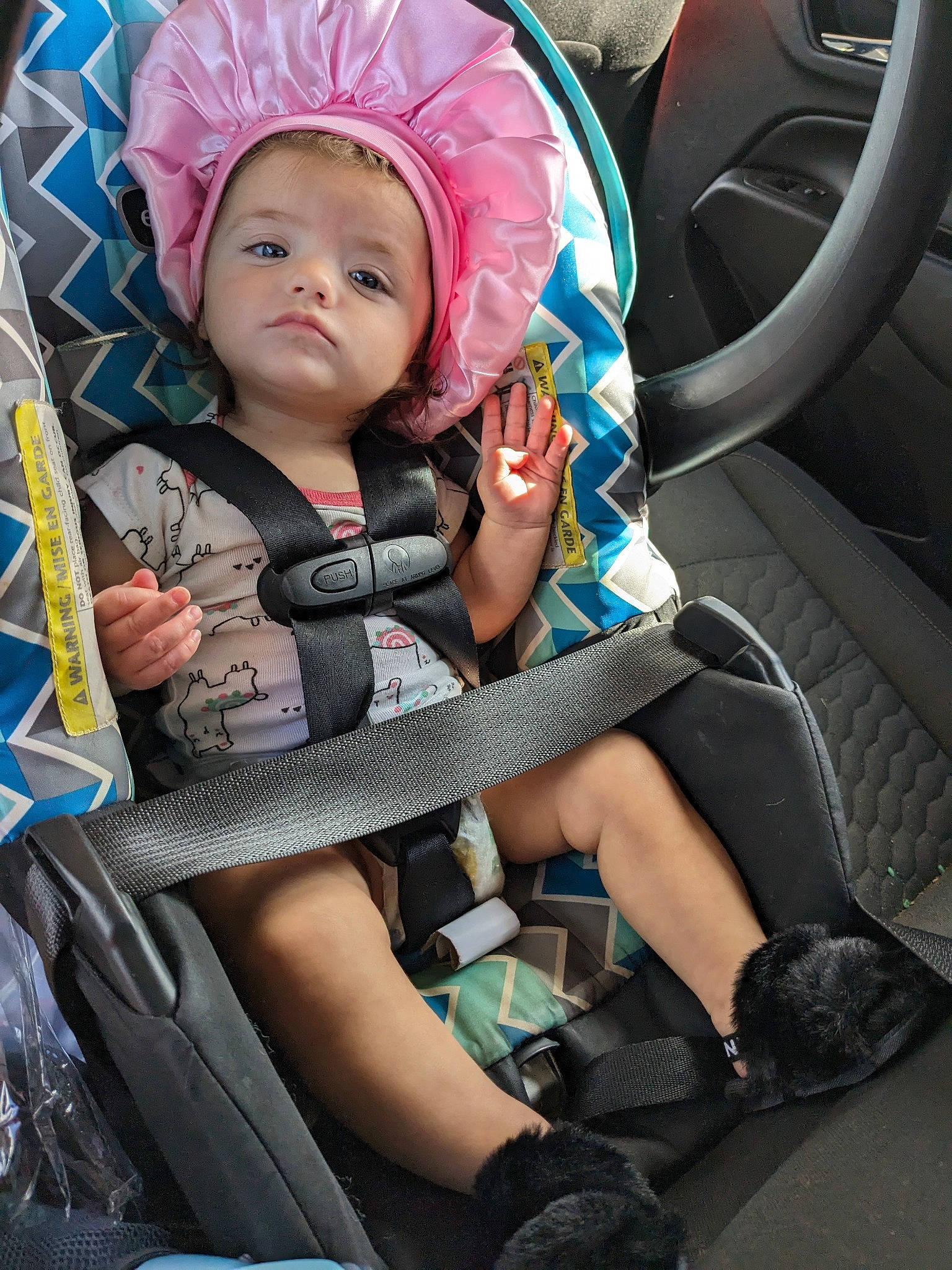 Isla is registered to the contest to win money with this photo: auto_part, automotive_tire, baby, baby_carriage, baby_products, baby_toddler_clothing, car_seat, car_seat_cover, child, comfort, electric_blue, family_car, fashion_accessory, head_restraint, motor_vehicle, person, personal_luxury_car, sitting, steering_wheel, toddler