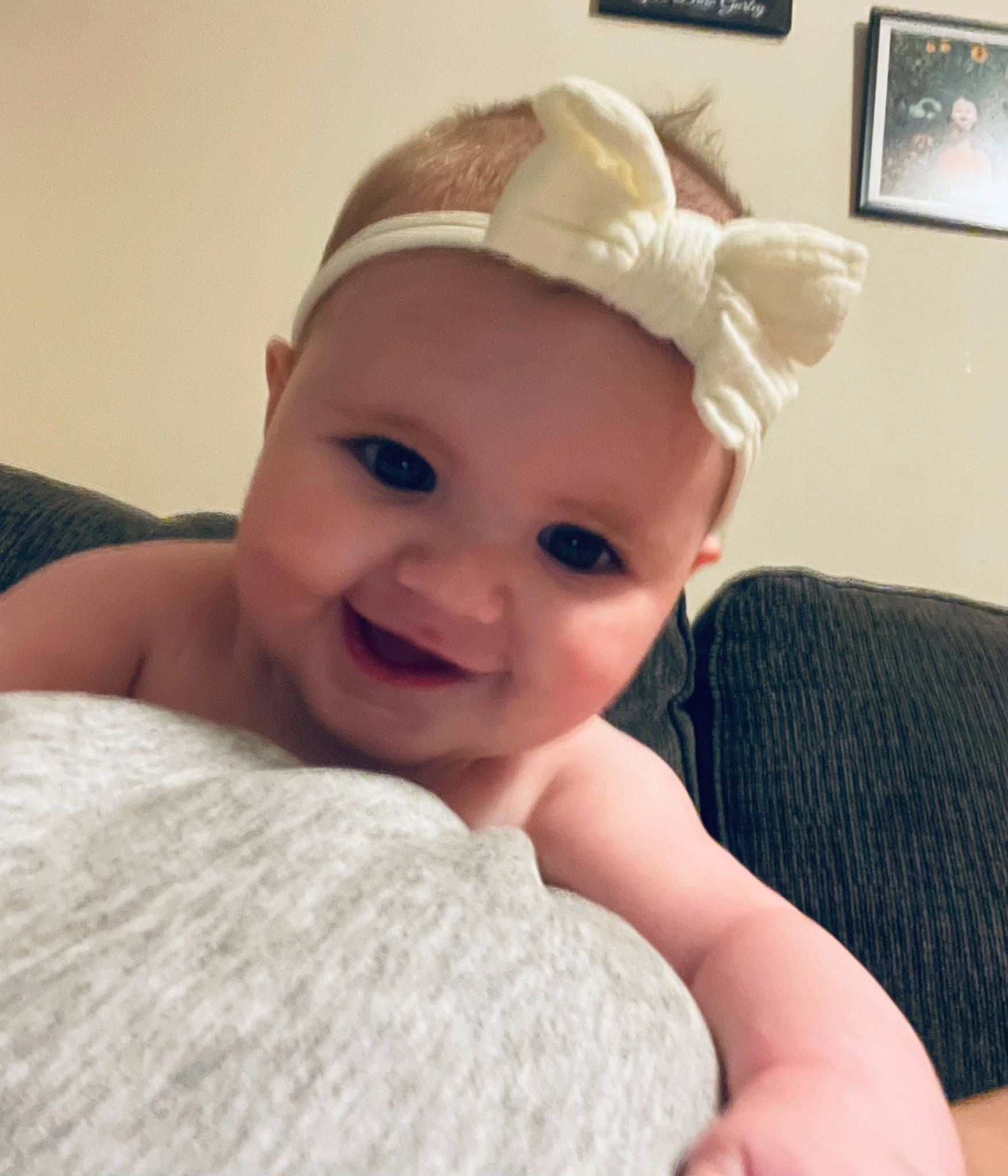 Averie joined the competition — help win amazing prizes! baby, baby_toddler_clothing, cap, cheek, comfort, ear, eye, eyelash, fashion_accessory, finger, gesture, hair_accessory, happy, headpiece, headwear, lip, person, picture_frame, skin, smile