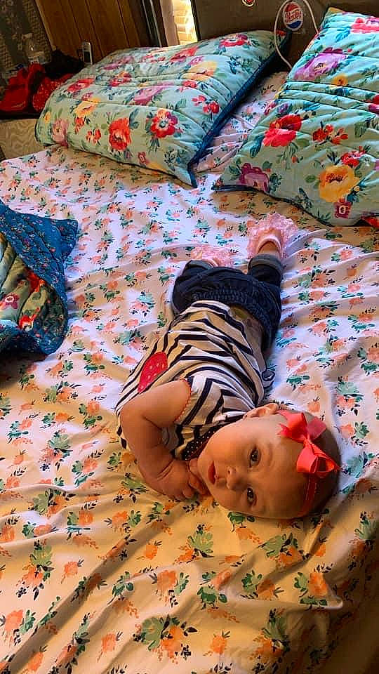 Juliet joined the competition — help win amazing prizes! baby, bed, bed_sheet, bedding, bedroom, bedtime, child, comfort, duvet, flooring, green, headwear, linens, mammal, pattern, person, product, room, textile, toddler