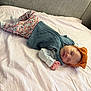 Lina Rose joined the competition — help win amazing prizes! baby, sleeping, floral_pants, headband, orange_bow, vest, blanket, couch, cozy, indoor, child, peaceful, resting, cute, infant, soft_lighting, home, portrait, relaxing, toddler