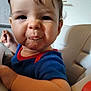 Marvynn participe au concours pour gagner de l'argent avec cette photo : toddler, child, face, messy, food, high_chair, blue_shirt, red_trim, indoor, curly_hair, close_up, expression, person, baby, cute, skin, mouth, hand, seated, young