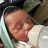 baby, blanket, bottle, bottle_nipple, closeup, eyes_closed, face, feeding, furniture, hand, hood, infant, milk, newborn, nursery_bag, peaceful, portrait, skin, sleeping, swaddle