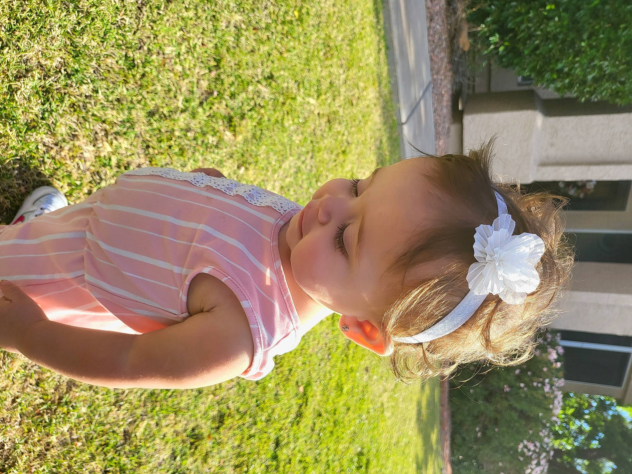 Angelica is registered to the contest to win money with this photo: baby_toddler_clothing, botany, child, fun, garden, grass, grass_family, green, happy, hat, leisure, people_in_nature, person, plant, smile, summer, toddler, tree, vacation, window