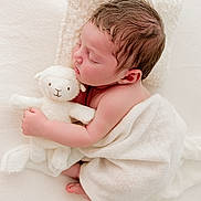 Everly is registered to the contest to win money with this photo: adorable, baby, blanket, child, cozy, cute, infant, lamb, newborn, peaceful, pillow, portrait, resting, sleeping, small, soft, stuffed_animal, tender, white, wrapped