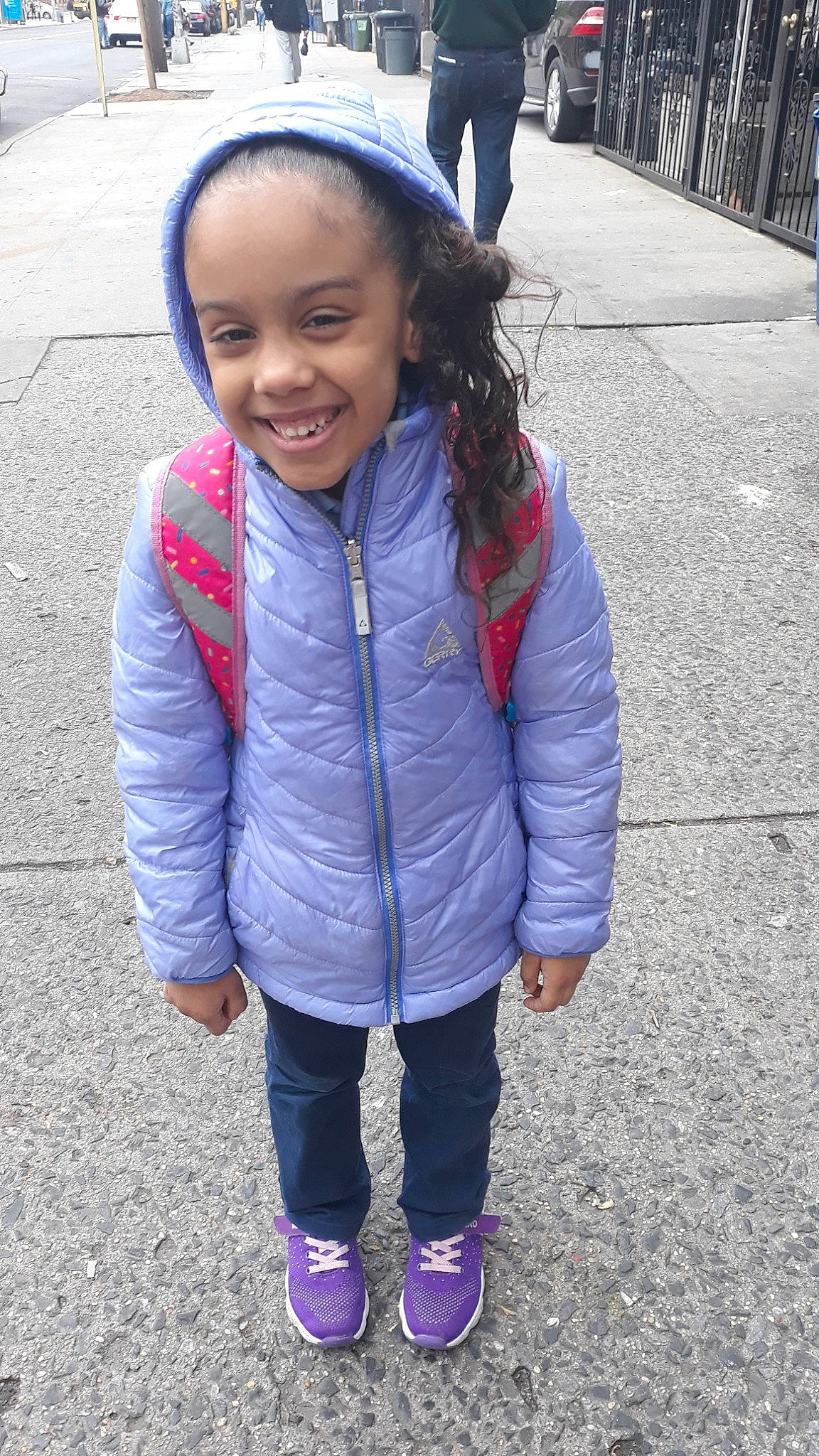 Gianni is registered to the contest to win money with this photo: child, cool, face, facial_expression, footwear, fun, happy, head, hood, hoodie, jacket, jeans, joy, outerwear, people, person, pink, play, purple, skin