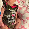 Oakleigh is registered to the contest to win money with this photo: newborn, baby, sleeping, infant, portrait, face, bed, bedding, floral, pink, onesie, clothing, camouflage, heart, arrow, toys, numbers, indoors, cute, relaxed