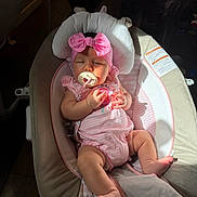 Oakleigh is registered to the contest to win money with this photo: baby, infant, child, sleeping, pacifier, headband, bow, pink_clothing, bouncer, baby_seat, portrait, indoor, sunlight, shadow, nursery, sitting, hands, feet, blanket, photograph