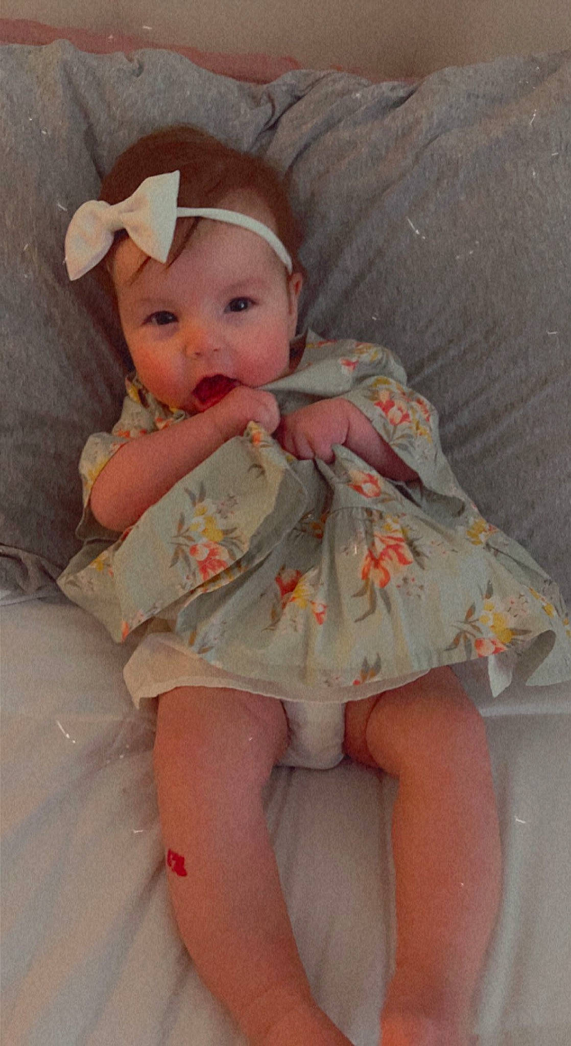 Lucía is registered to the contest to win money with this photo: baby, baby_toddler_clothing, cheek, day_dress, dress, embellishment, eye, face, finger, head, headgear, human_body, iris, lip, person, pink, skin, sleeve, textile, thigh