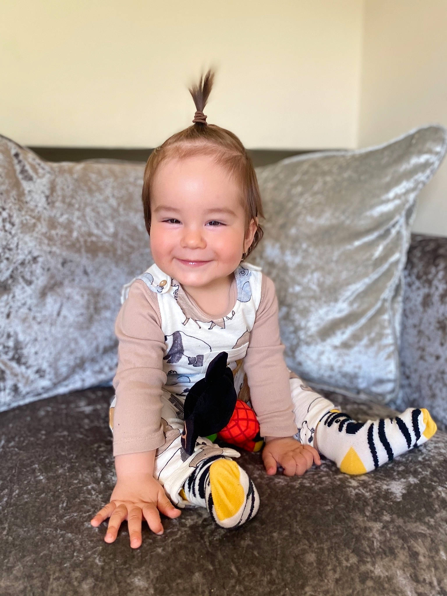 Mario is registered to the contest to win money with this photo: baby, baby_toddler_clothing, child, comfort, couch, eye, face, facial_expression, flash_photography, floor, flooring, fun, happy, hardwood, joy, person, product, sitting, smile, sock