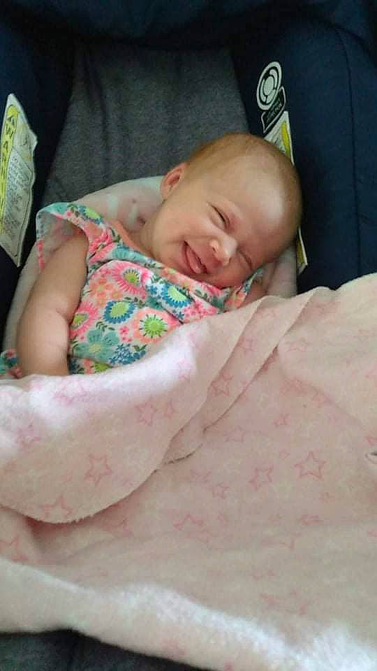 Hadlee is registered to the contest to win money with this photo: baby, baby_products, baby_toddler_clothing, bedding, bedtime, cheek, child, comfort, event, eye, head, linens, nap, pattern, person, pink, room, sleep, sleeve, smile