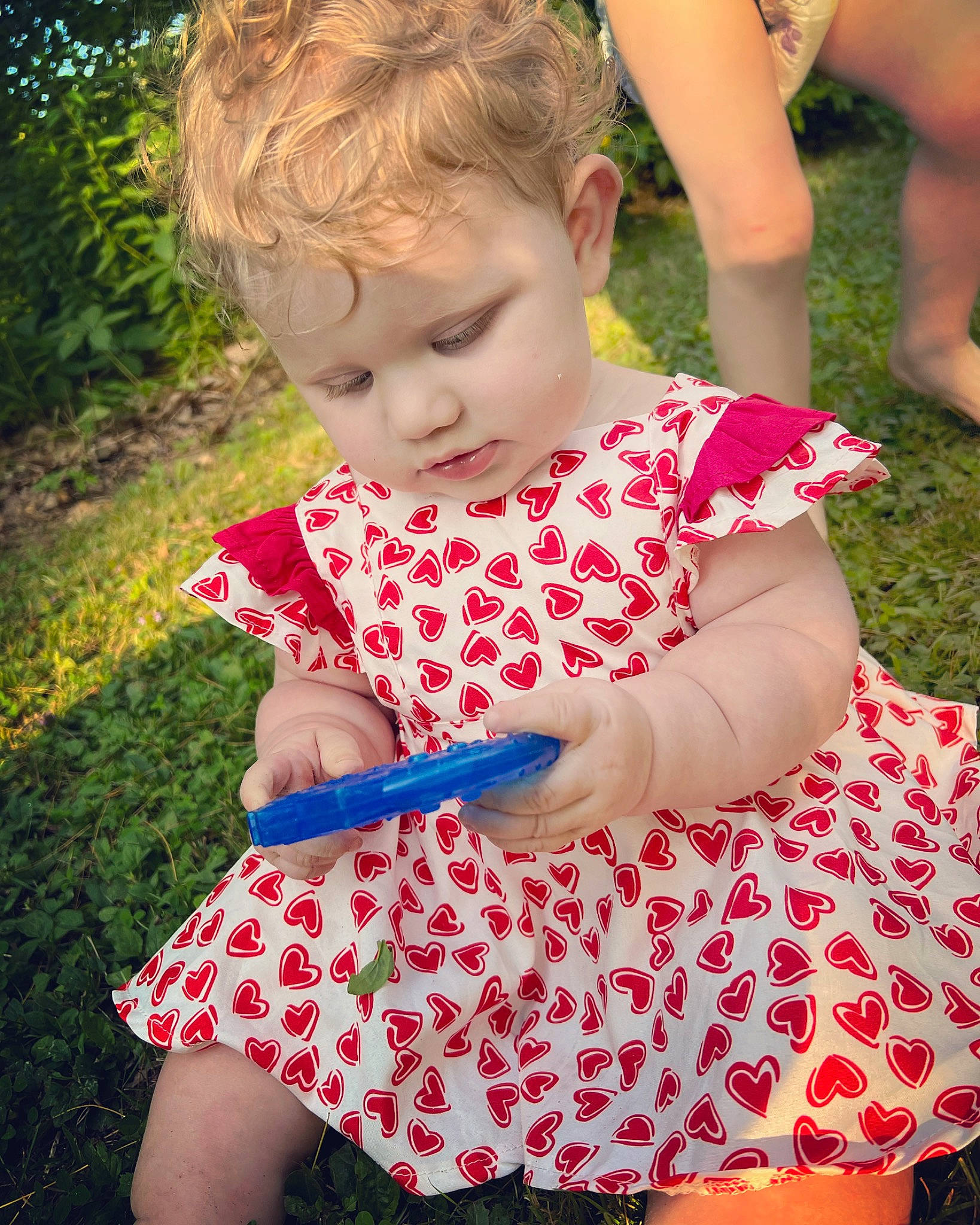 Crystal joined the competition — help win amazing prizes! baby_toddler_clothing, dress, finger, fun, grass, green, hair, hairstyle, hand, happy, human_body, people, people_in_nature, person, photograph, pink, plant, red, skin, sleeve