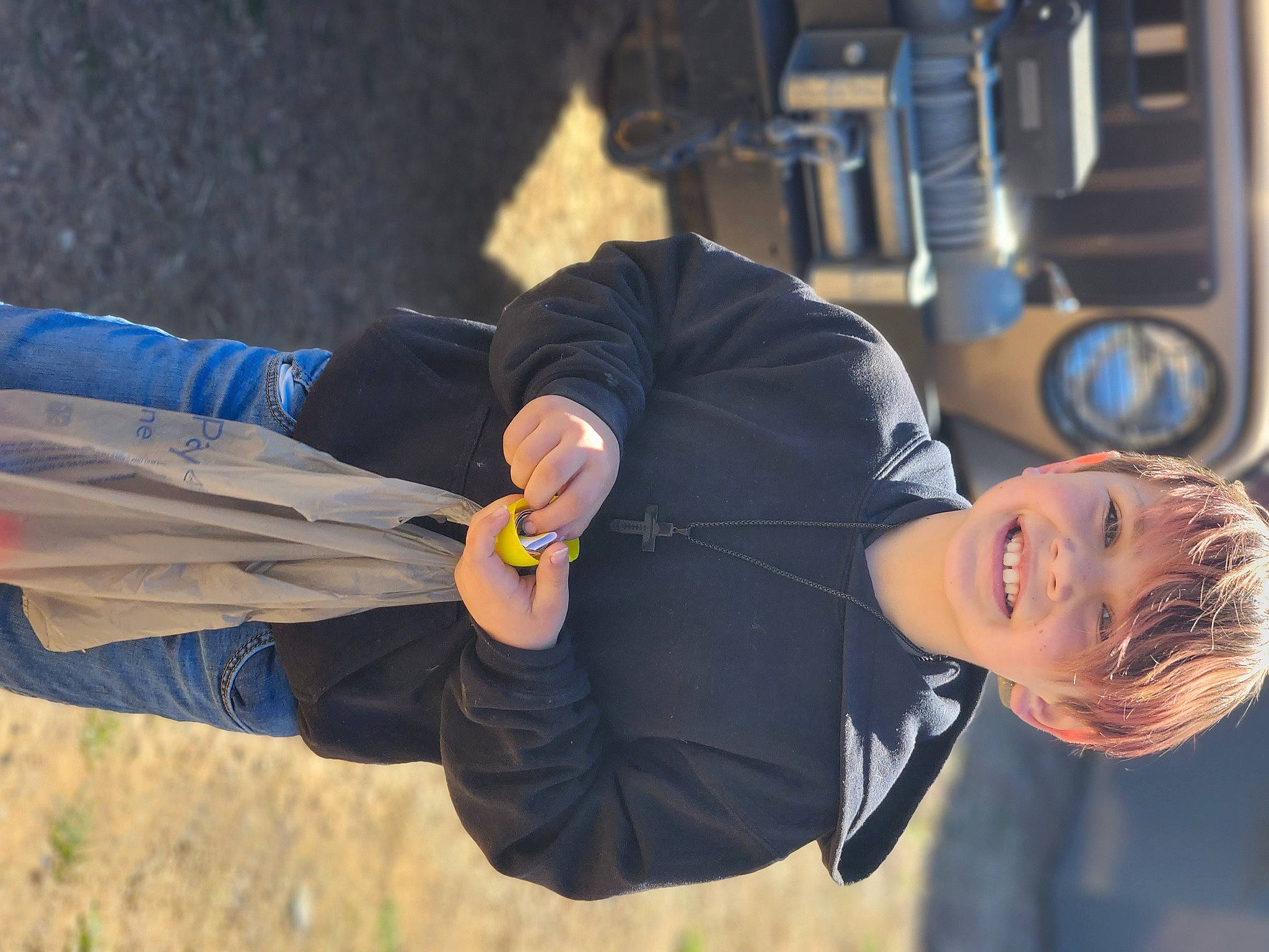 Braydon is registered to the contest to win money with this photo: arm, elbow, electric_blue, fun, gesture, glove, hand, happy, hat, human, joint, joy, landscape, person, plant, recreation, sitting, smile, soil, tree