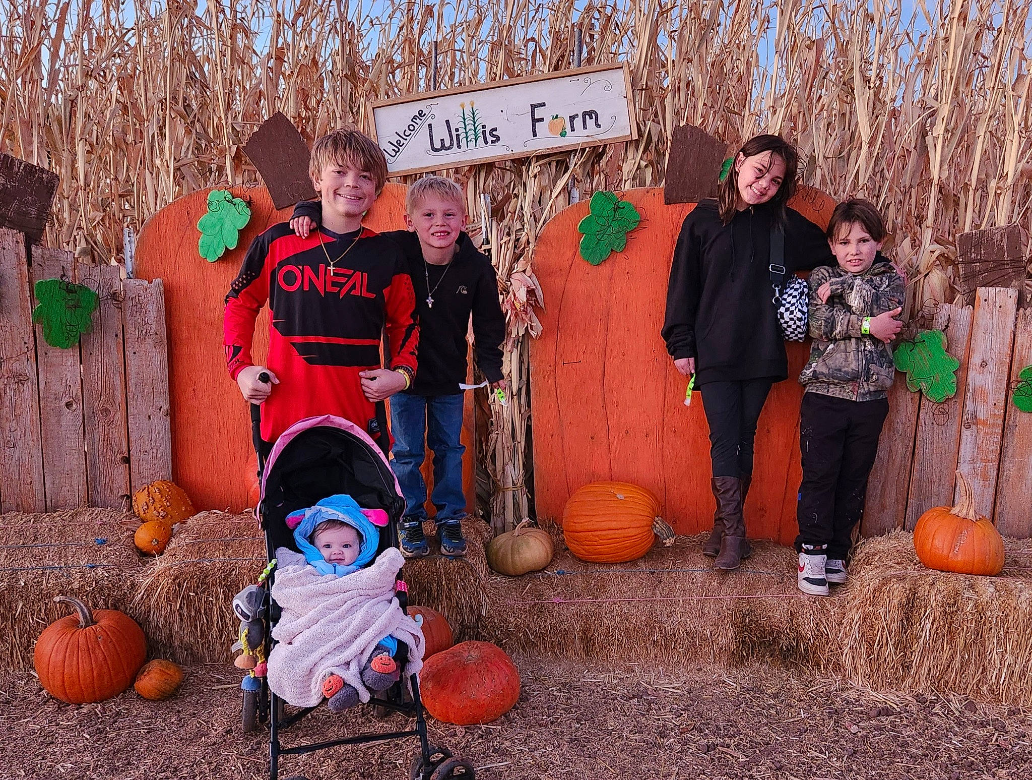 Brylee Garcia is registered to the contest to win money with this photo: boot, calabaza, cucurbita, event, fun, gourd, grass, hat, joy, leisure, local_food, orange, people_in_nature, person, pumpkin, smile, squash, tree, trousers, vegetable