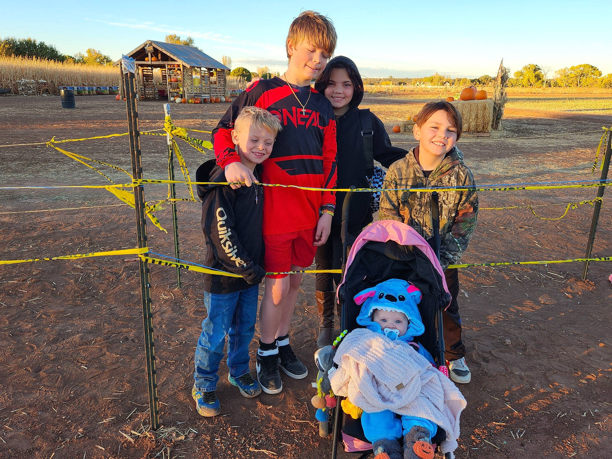 Brylee Garcia is registered to the contest to win money with this photo: asphalt, child, fun, grass, grassland, happy, jacket, joy, landscape, leisure, motor_vehicle, outdoor_play_equipment, people_in_nature, person, play, recreation, sky, smile, soil, toddler