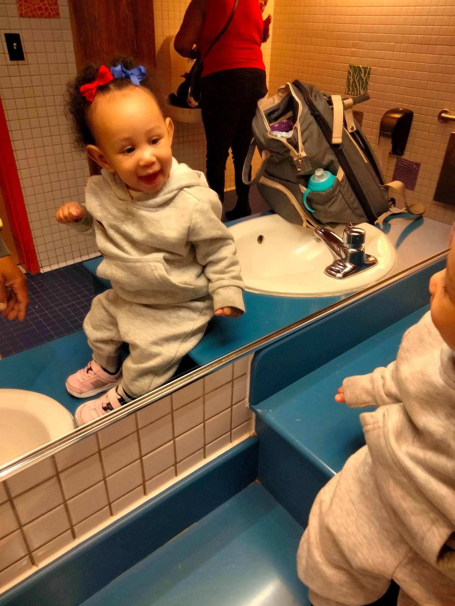 Nahla is registered to the contest to win money with this photo: arm, bathroom, child, finger, flooring, fun, hand, leisure, musical_instrument, person, photograph, play, purple, room, service, smile, snapshot, toddler, toilet, wood