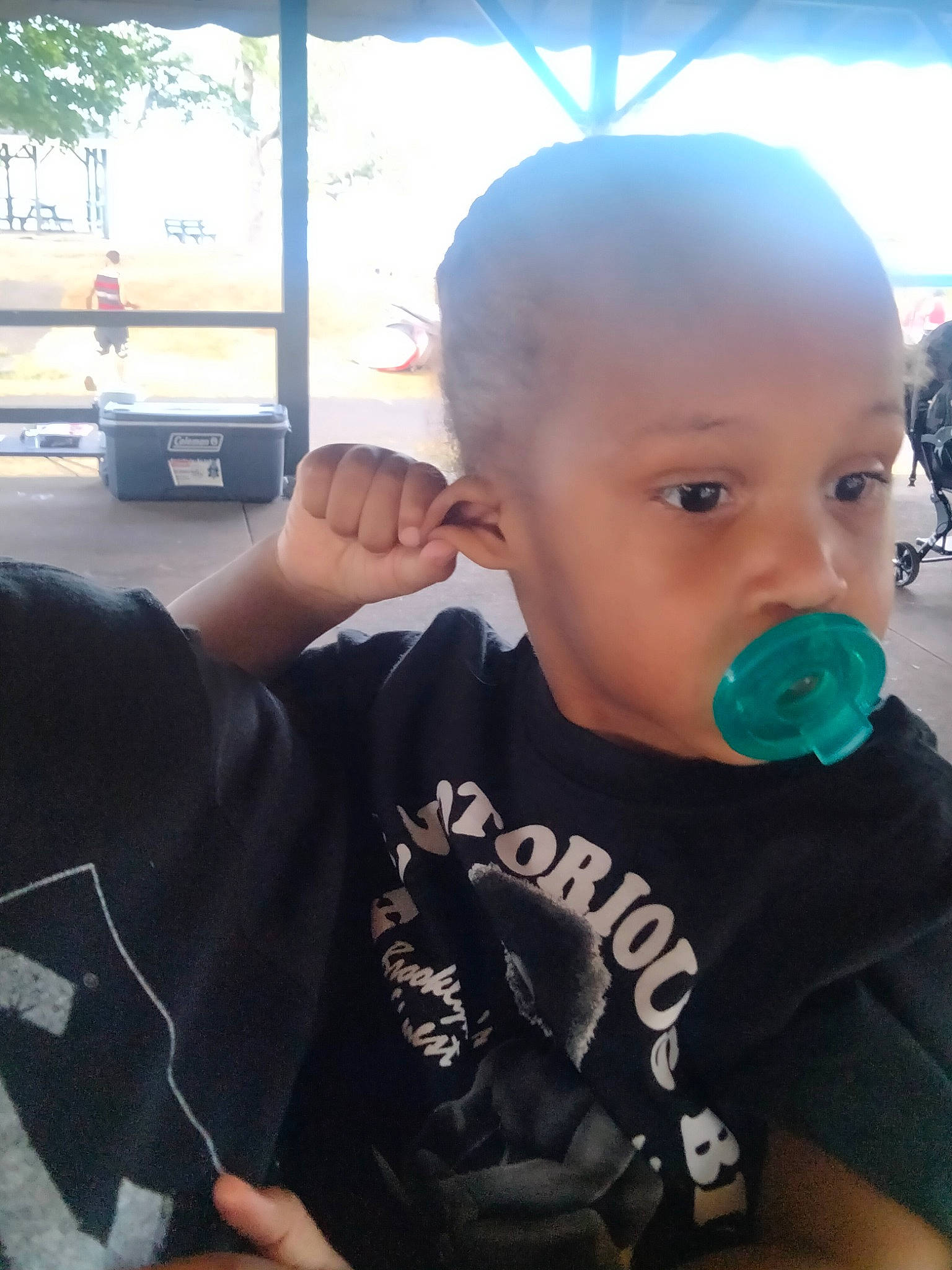 Micah joined the competition — help win amazing prizes! baby, baby_toddler_clothing, cheek, child, chin, ear, elbow, fun, gesture, happy, microphone, neck, person, shoulder, sitting, sleeve, t_shirt, thumb, toddler