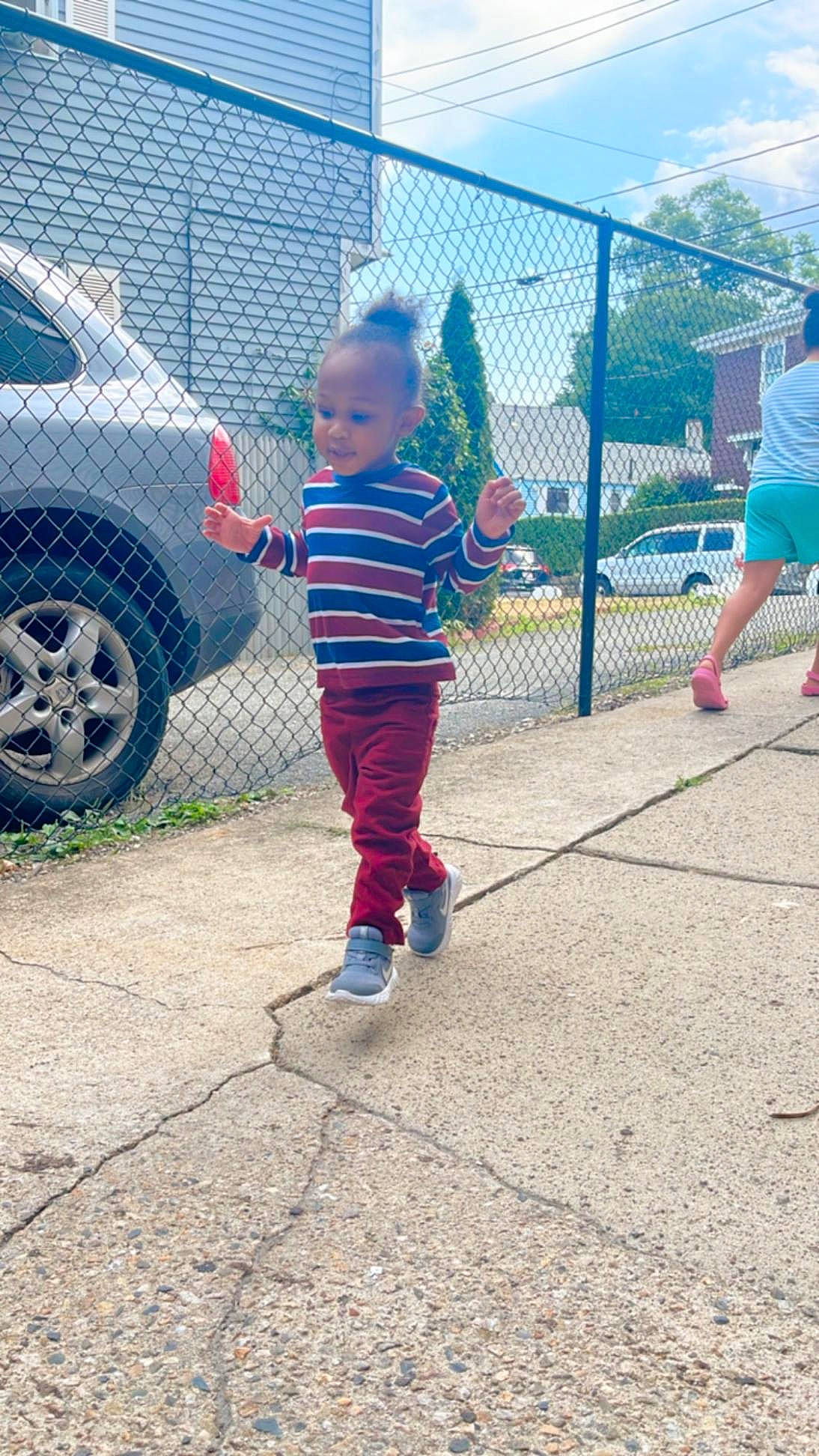 Micah joined the competition — help win amazing prizes! asphalt, automotive_exterior, car, family_car, fence, fun, grass, leisure, mid_size_car, parking, person, recreation, rim, shorts, t_shirt, tire, toddler, tree, vehicle, vehicle_door