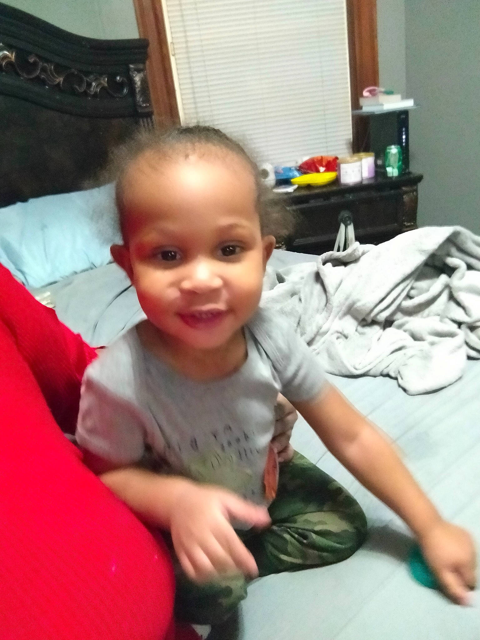 Micah is registered to the contest to win money with this photo: baby, baby_toddler_clothing, chair, child, comfort, curtain, desk, flooring, fun, hand, happy, joy, lap, linens, person, room, sitting, smile, sock, t_shirt