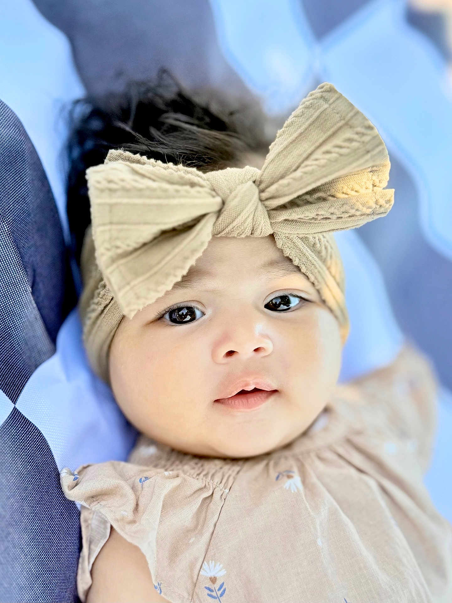 Raveena is registered to the contest to win money with this photo: baby, child, face, headband, bow, dress, portrait, closeup, cute, infant, young, skin, eyes, clothing, fabric, smile, soft, resting, indoor, comfortable
