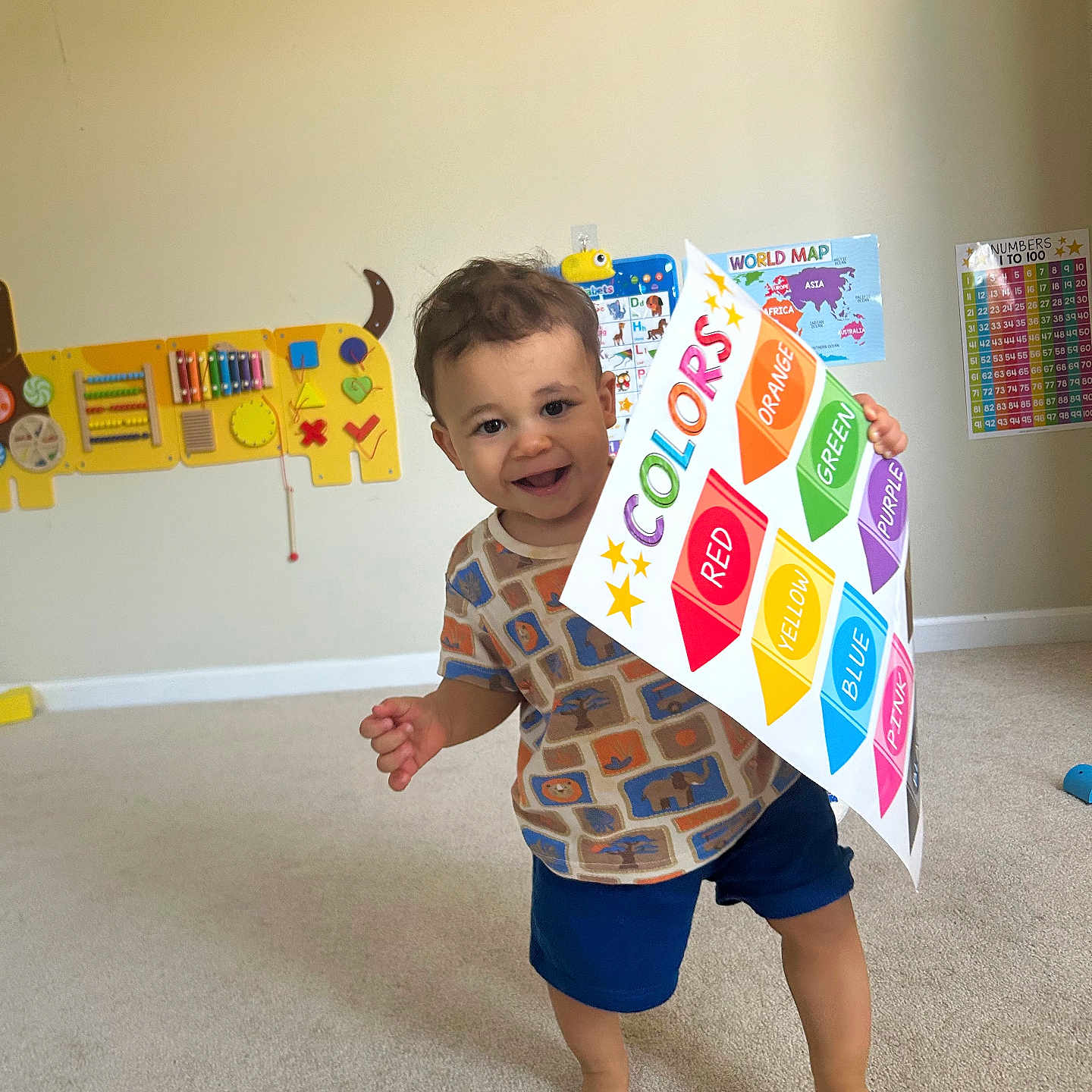 Langston joined the competition — help win amazing prizes! barefoot, boy, carpet, child, colors, cute, educational, happy, indoor, learning, map, numbers_chart, playroom, poster, shirt, shorts, smiling, toddler, toy, walking