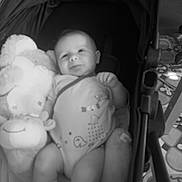 Bastien a rejoint le concours — aidez-le/la à gagner de superbes lots ! baby, babywear, blanket, child, clothing, comfort, cozy, cute, face, floor_tiles, indoor, infant, monochrome, person, plush_toy, relaxing, seat, sock, stroller, toy