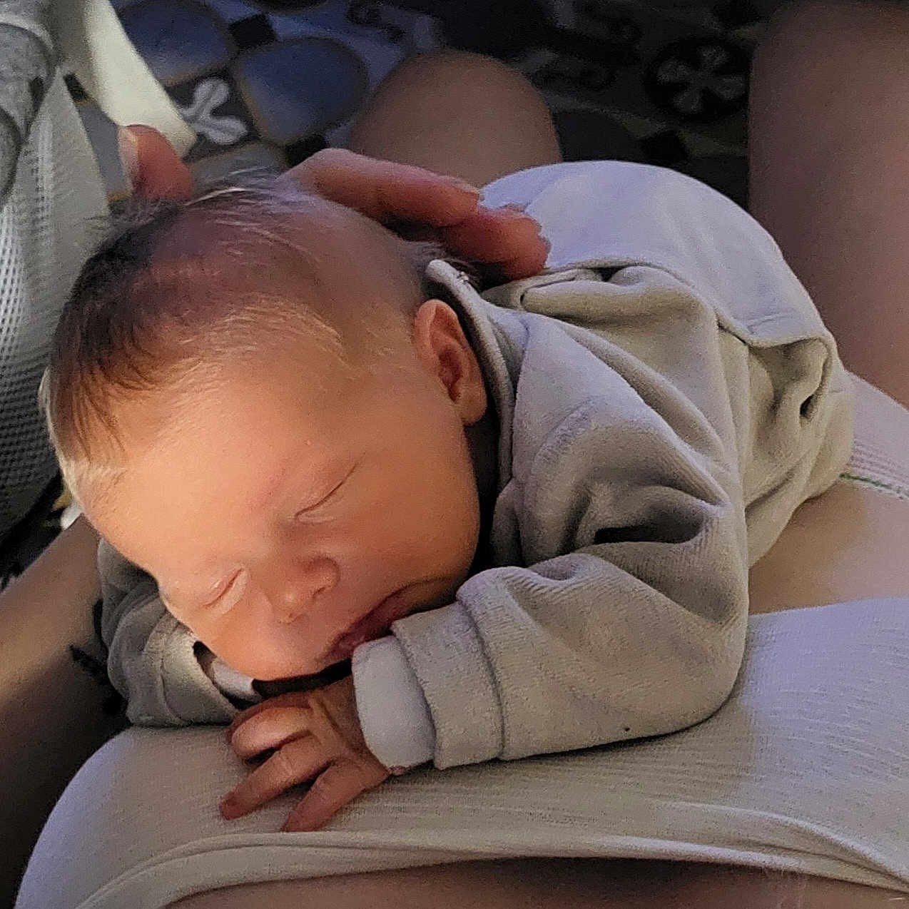 Bastien participe au concours pour gagner de l'argent avec cette photo : arm, baby, blanket, care, closeup, clothing, face, hand, head, indoors, infant, newborn, peaceful, person, portrait, resting, skin, sleeping, soft, tender