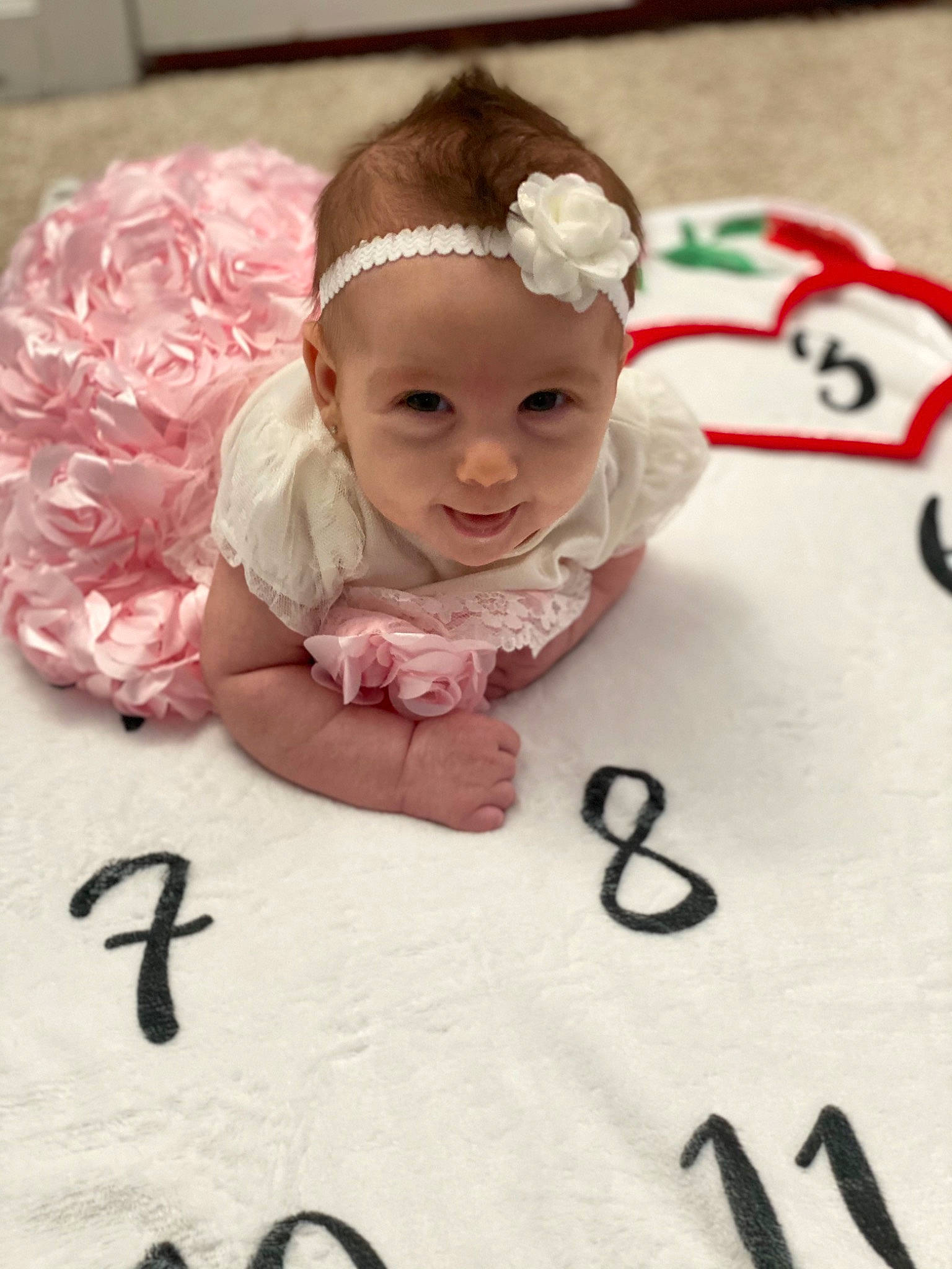 Kynslee joined the competition — help win amazing prizes! baby, baby_products, baby_toddler_clothing, cap, cheek, child, facial_expression, fashion_accessory, finger, hair_accessory, happy, headband, headpiece, headwear, person, petal, pink, skin, sleeve, smile
