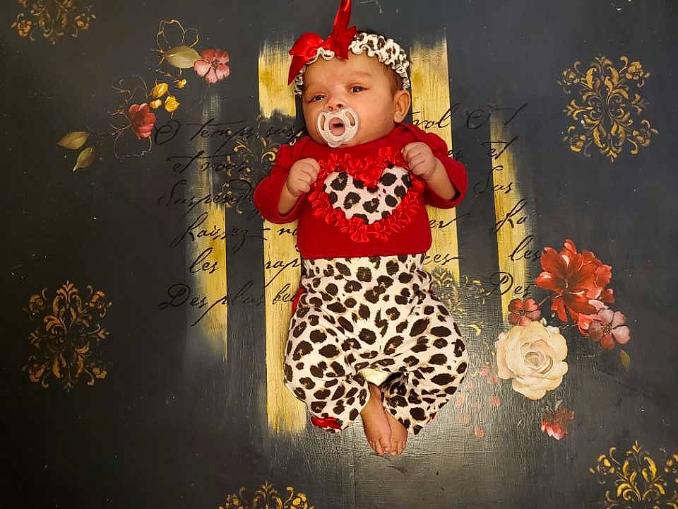 Amiah joined the competition — help win amazing prizes! art, baby, baby_toddler_clothing, child, costume_hat, event, flash_photography, floral_design, happy, headwear, holiday, lighting, party_supply, pattern, people_in_nature, person, red, room, still_life_photography, toddler