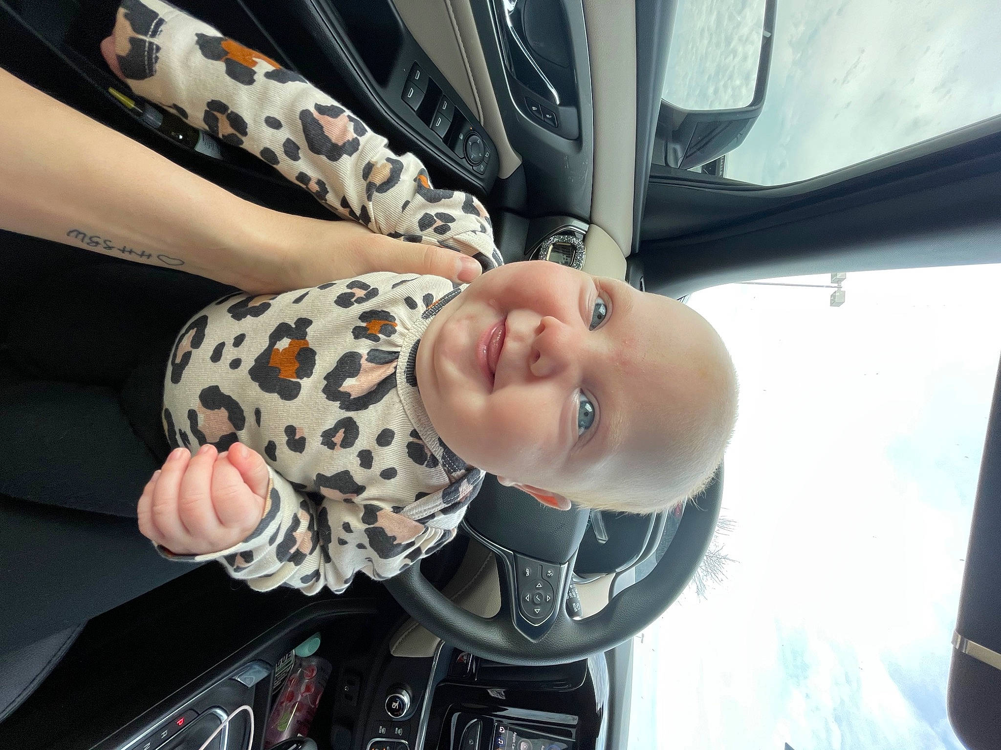 Hadley joined the competition — help win amazing prizes! arm, auto_part, automotive_design, automotive_exterior, automotive_lighting, automotive_tire, automotive_wheel_system, baby, bumper, car, dress, finger, hand, hat, headgear, hood, motor_vehicle, person, smile, vehicle