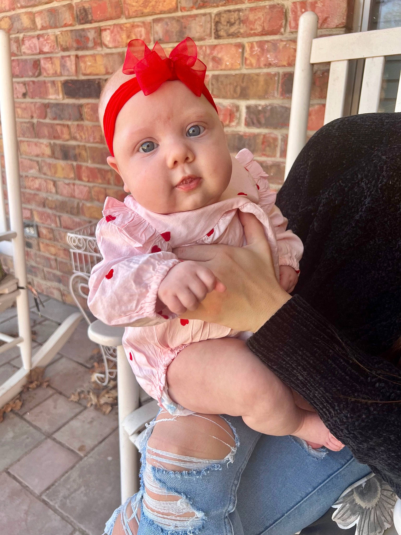 Hadley is registered to the contest to win money with this photo: baby, baby_products, baby_toddler_clothing, blond, chair, cheek, eye, foot, head, headwear, human_leg, knee, lap, leg, person, pink, skin, sleeve, sock, thigh