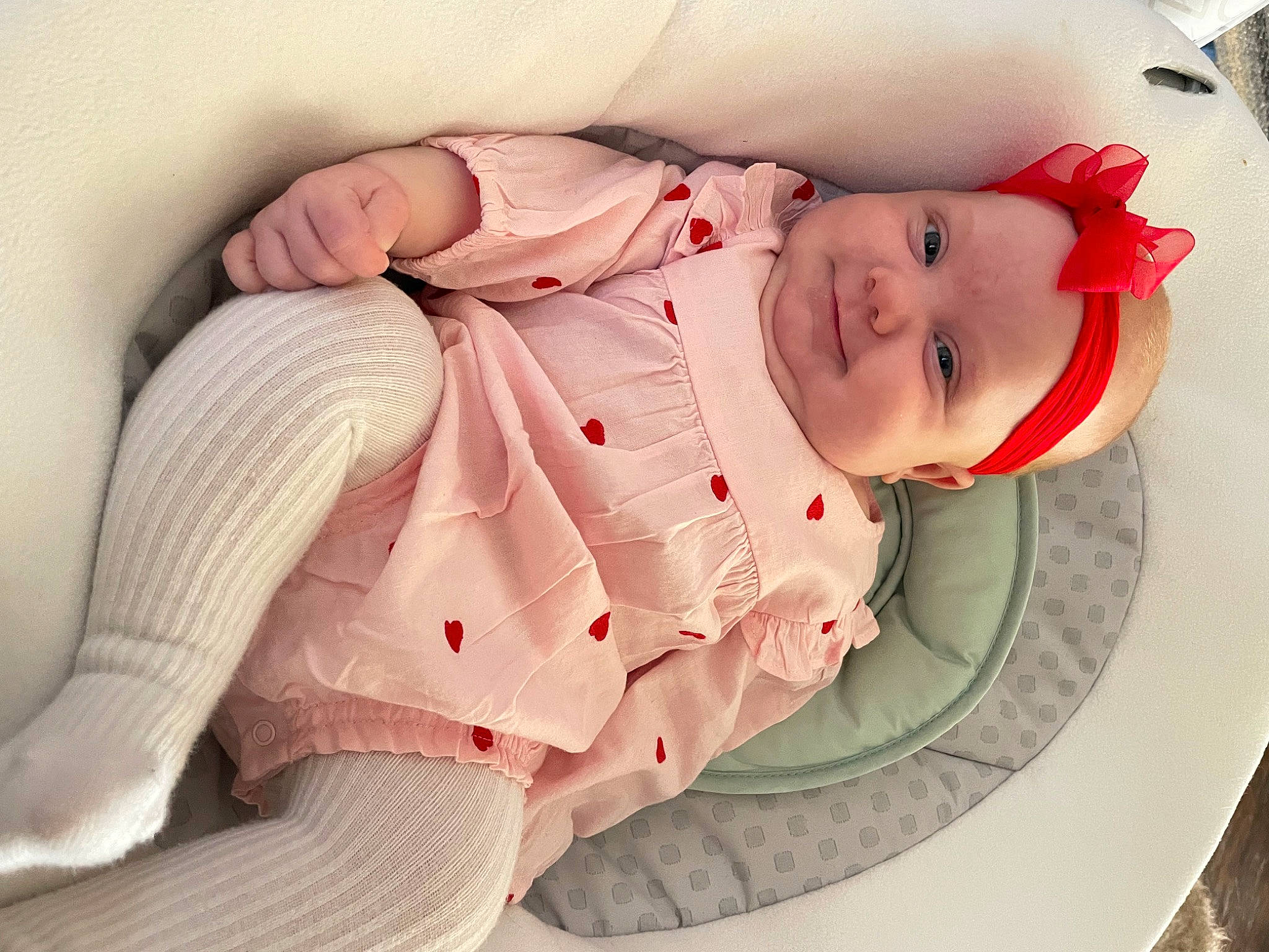 Hadley is registered to the contest to win money with this photo: arm, baby, baby_products, baby_toddler_clothing, carmine, child, clothing, comfort, elbow, hand, hat, headwear, human_body, human_leg, joy, knee, leg, person, sitting, skin