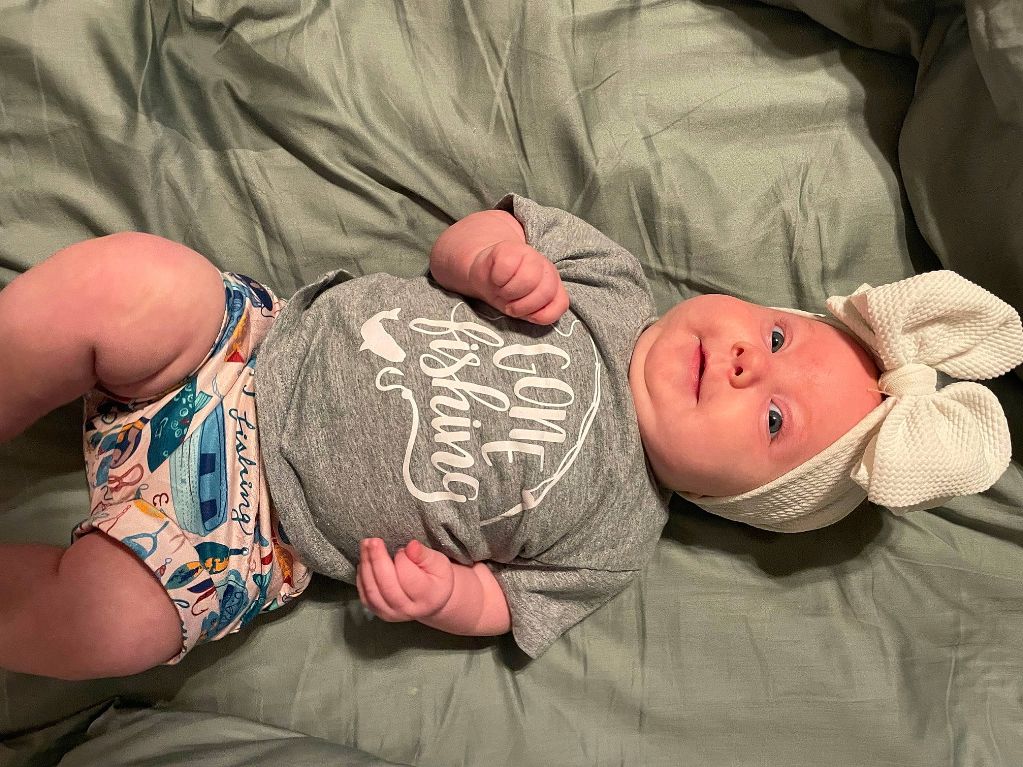 Hadley joined the competition — help win amazing prizes! abdomen, arm, baby, child, comfort, elbow, facial_expression, finger, glasses, headwear, human_body, joint, mammal, muscle, person, skin, sleeve, smile, stomach, thigh