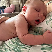 George joined the competition — help win amazing prizes! baby, sleeping, blanket, plush_toy, armchair, indoor, child, peaceful, mouth_open, skin, person, cozy, furniture, pillow, pattern, soft, rest, cute, infant, relax