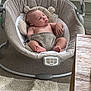 George is registered to the contest to win money with this photo: baby, infant, baby_rocker, plush, carpet, toy, carrot_toy, indoor, sleeping, child, face, furniture, home, relaxing, comfort, soft, clothing, person, peaceful, neutral_colors
