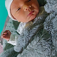 Lucas is registered to the contest to win money with this photo: newborn, baby, blanket, hat, sleepy, infant, soft_texture, cozy, wrapped, pacifier, bed, cute, face, hand, resting, indoors, child, warm, comfort, portrait